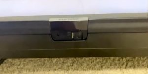 Where is the power button on a Samsung TV?
